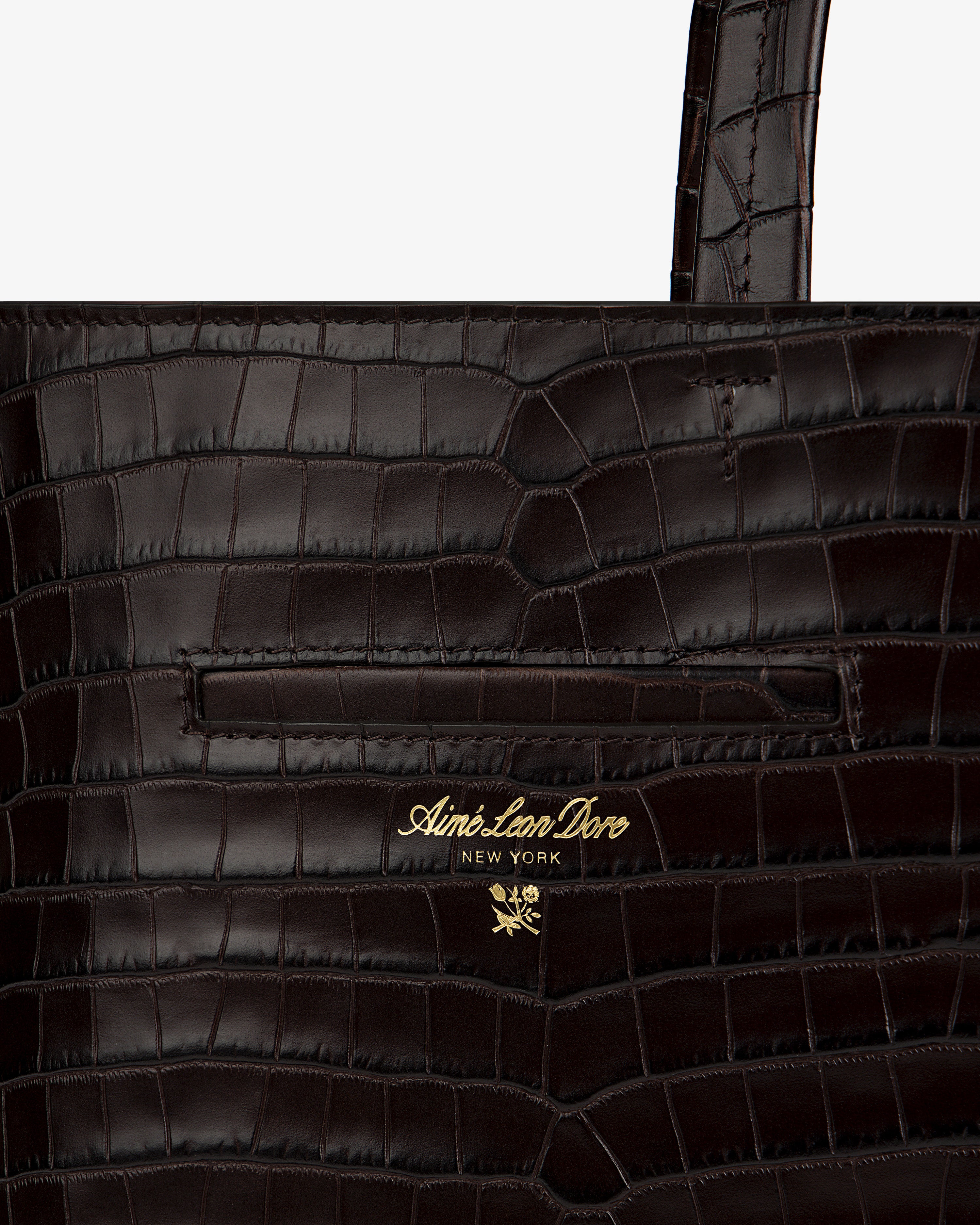 Dark brown croc-embossed leather Croc-Embossed Leather Shoulder Bag with gold logo text and a small flower emblem.