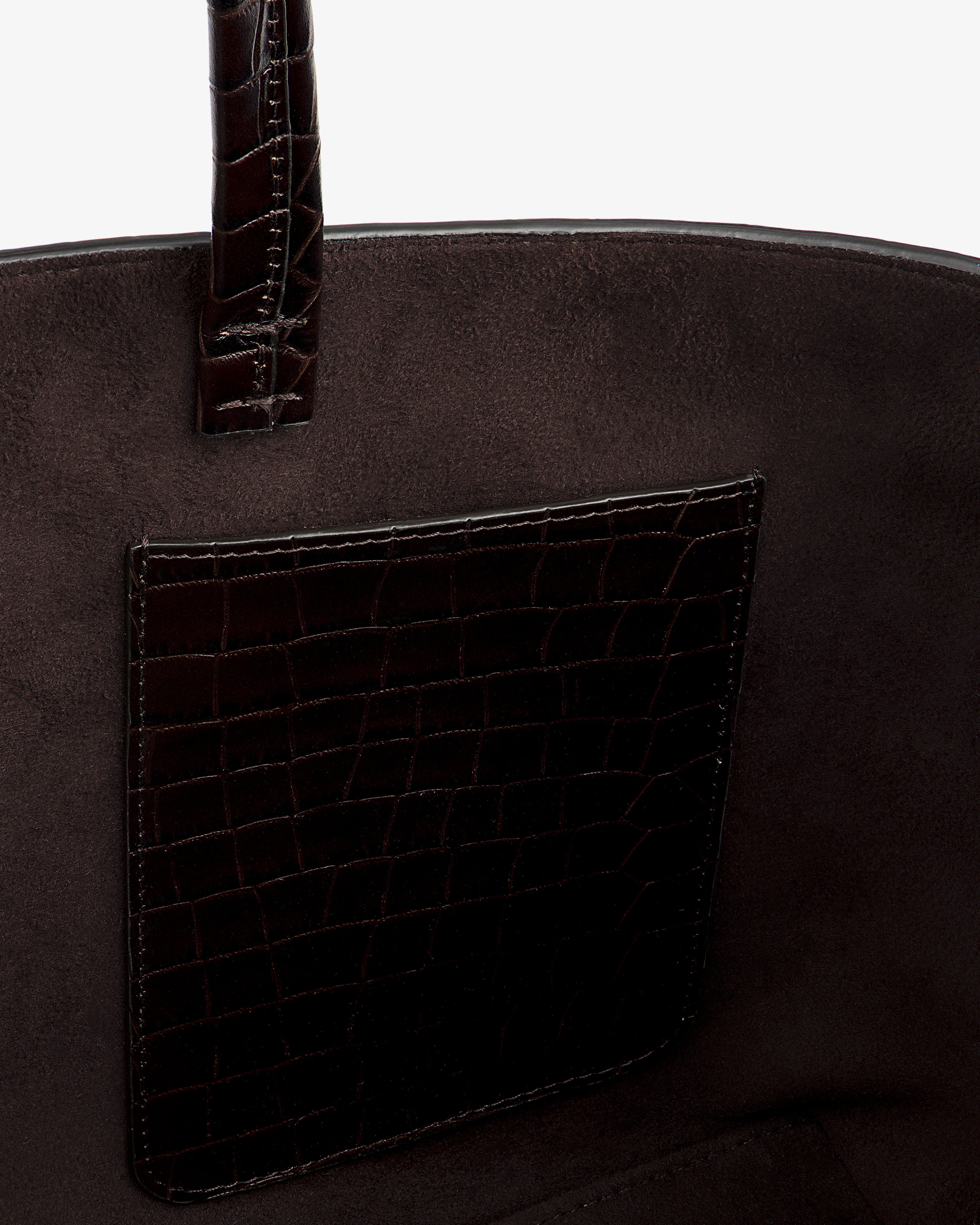 Close-up of the interior of a dark brown Croc-Embossed Leather Shoulder Bag, showing a crocodile-embossed pocket.