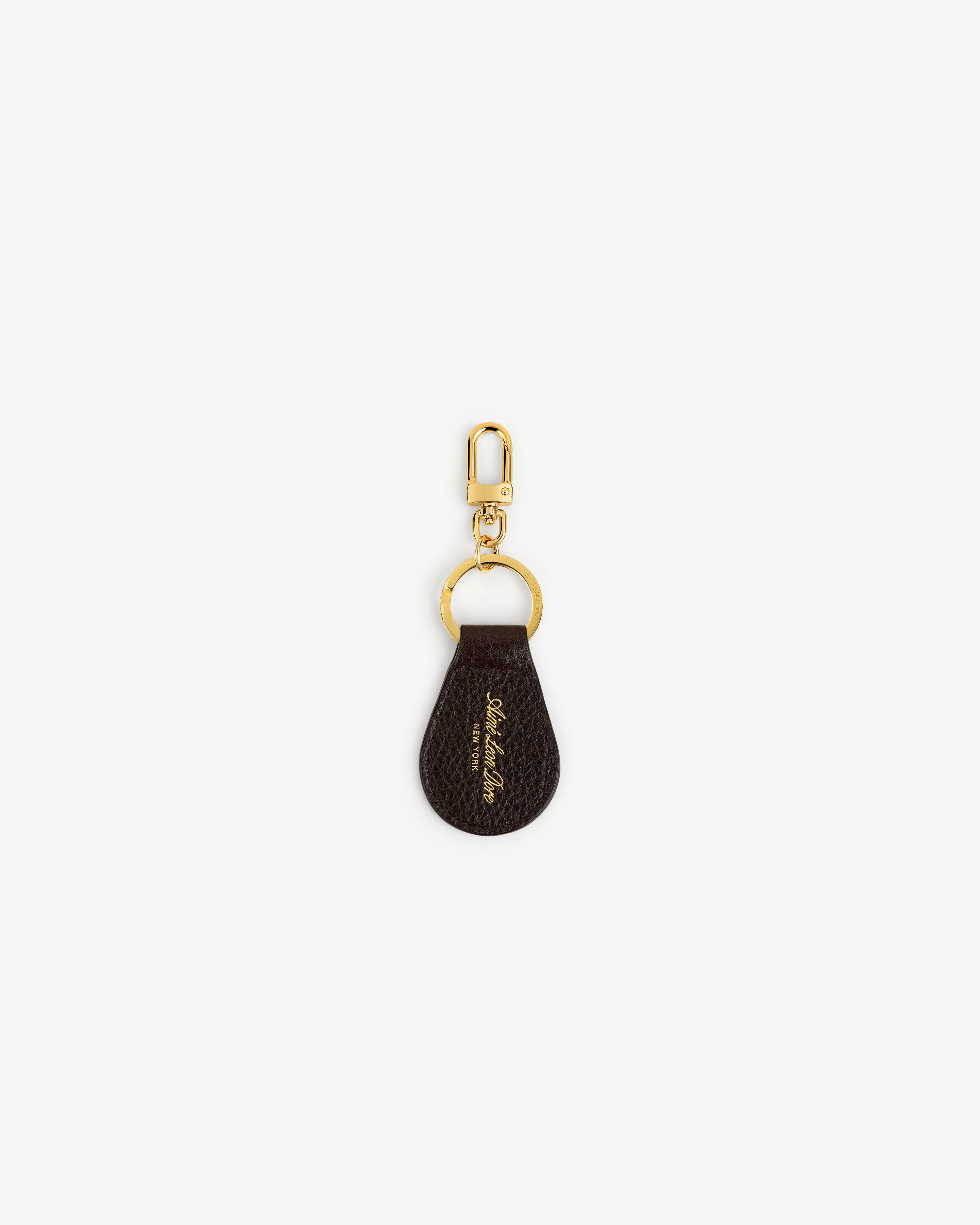 Tumbled Leather Key Fob with gold hardware and a small gold signature detail on brown leather.