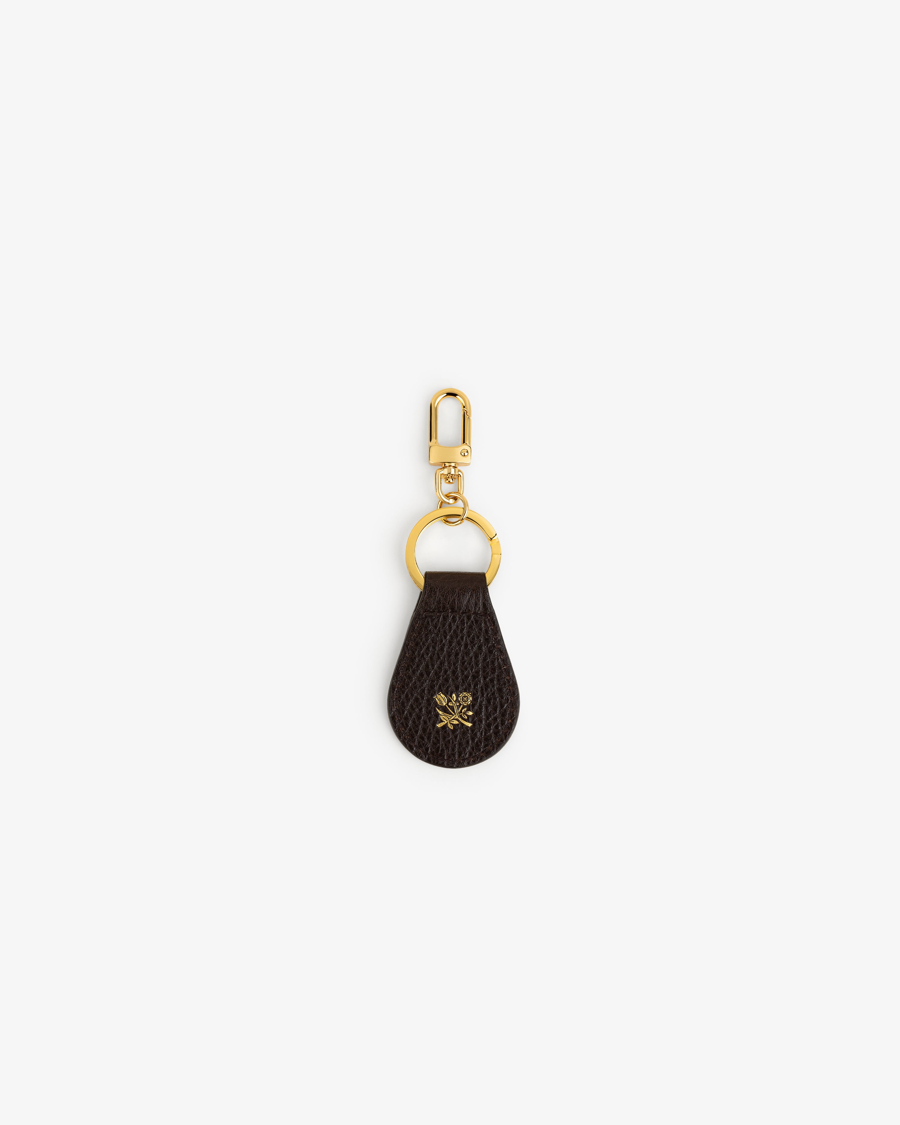 Tumbled Leather Key Fob in dark brown with gold hardware and a small gold emblem, shown on a white background.