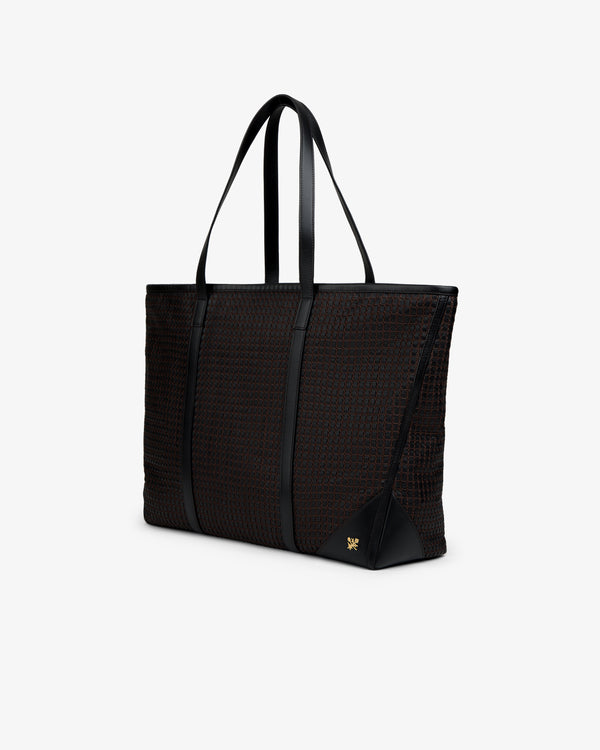 Black Woven Leather Tote Bag with a woven grid pattern and thin shoulder straps.