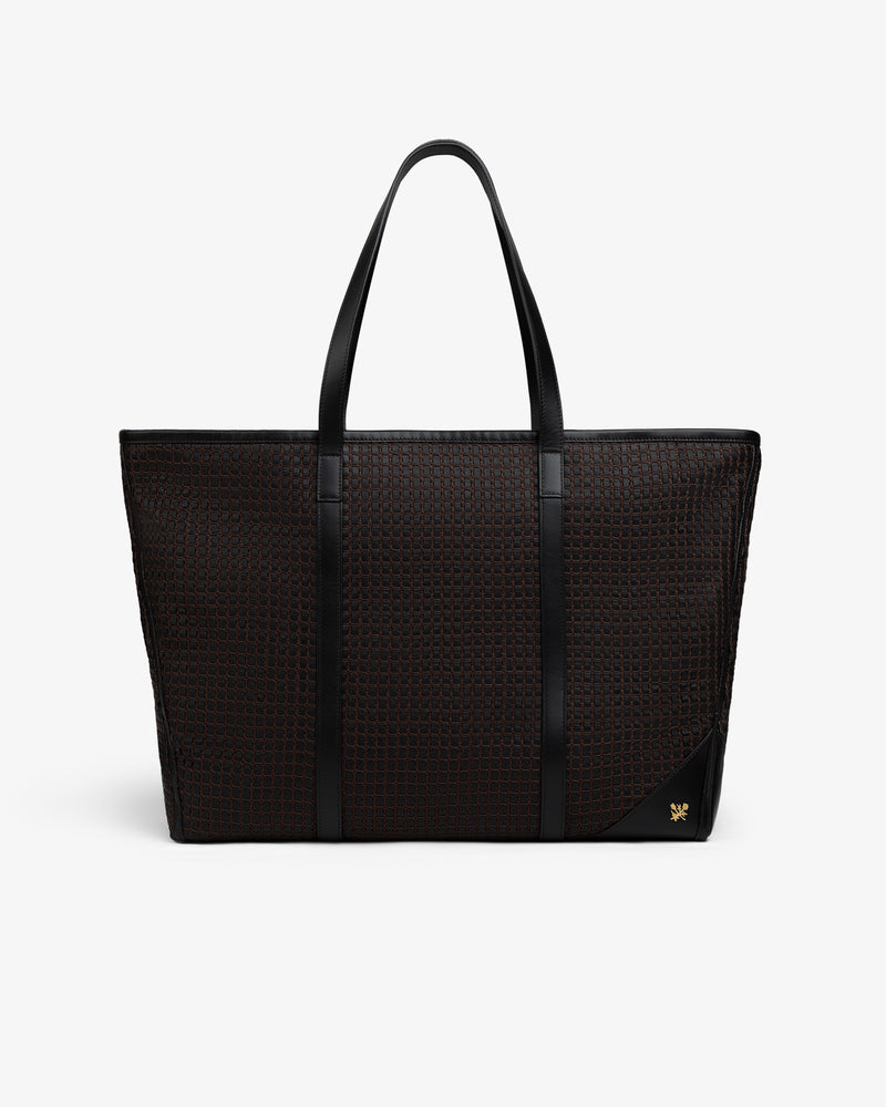 Black Woven Leather Tote Bag with a woven grid pattern, slim shoulder straps, and a gold emblem in the bottom corner.