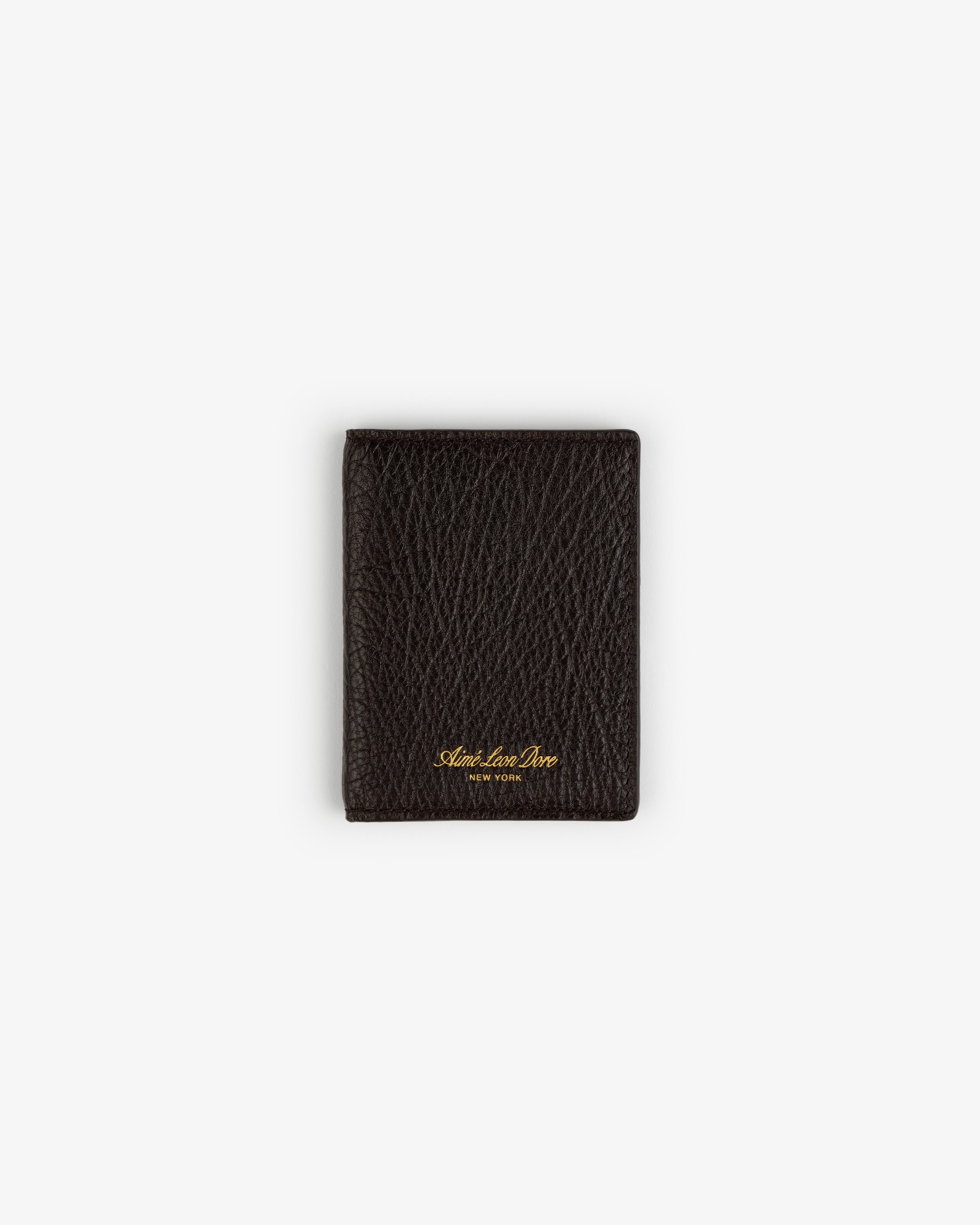Tumbled Leather Bi-Fold Wallet in dark brown leather with gold text, centered on a plain white background.