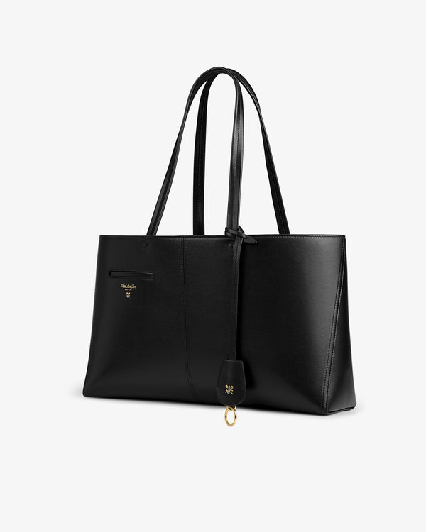Napa Leather Shoulder Bag in black with dual shoulder straps and a gold-toned keychain charm.