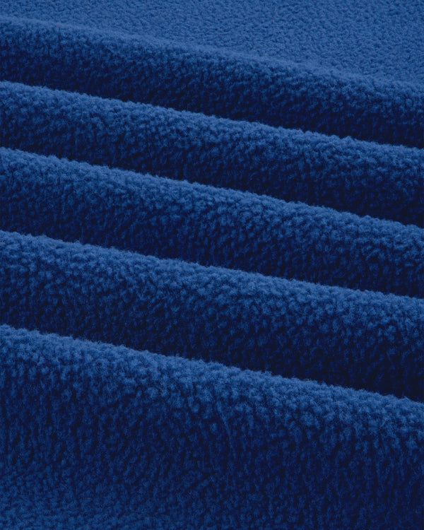 Close-up of the ALD / The North Face Denali Fleece Scarf, highlighting its soft, textured blue fleece surface.
