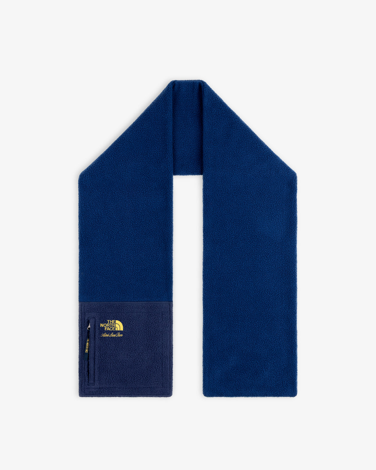 ALD / The North Face Denali Fleece Scarf in dark blue with a zip pocket and yellow logo, shown on white background.