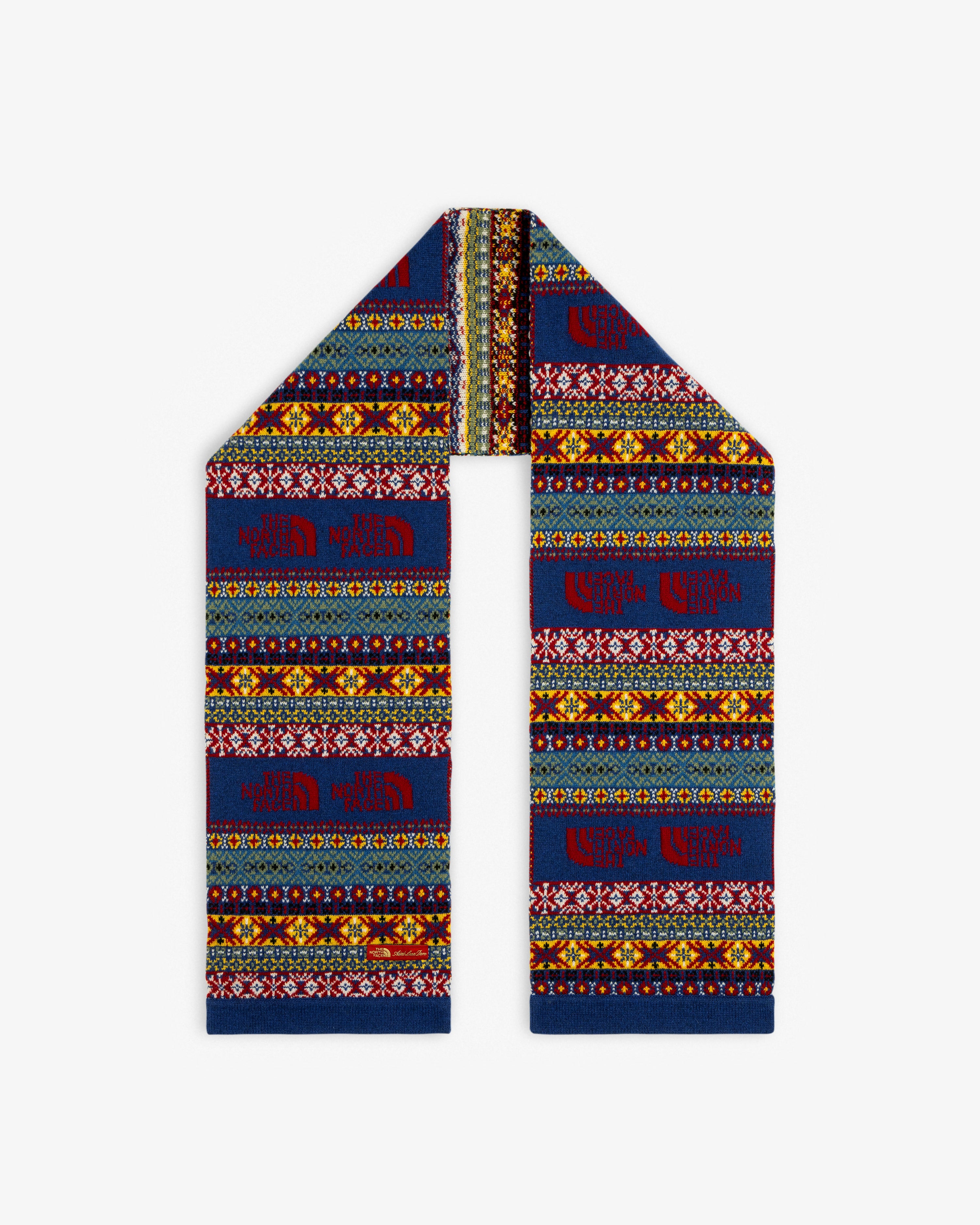 ALD / The North Face Fair Isle Scarf featuring vibrant geometric patterns, folded to a point on a white background.