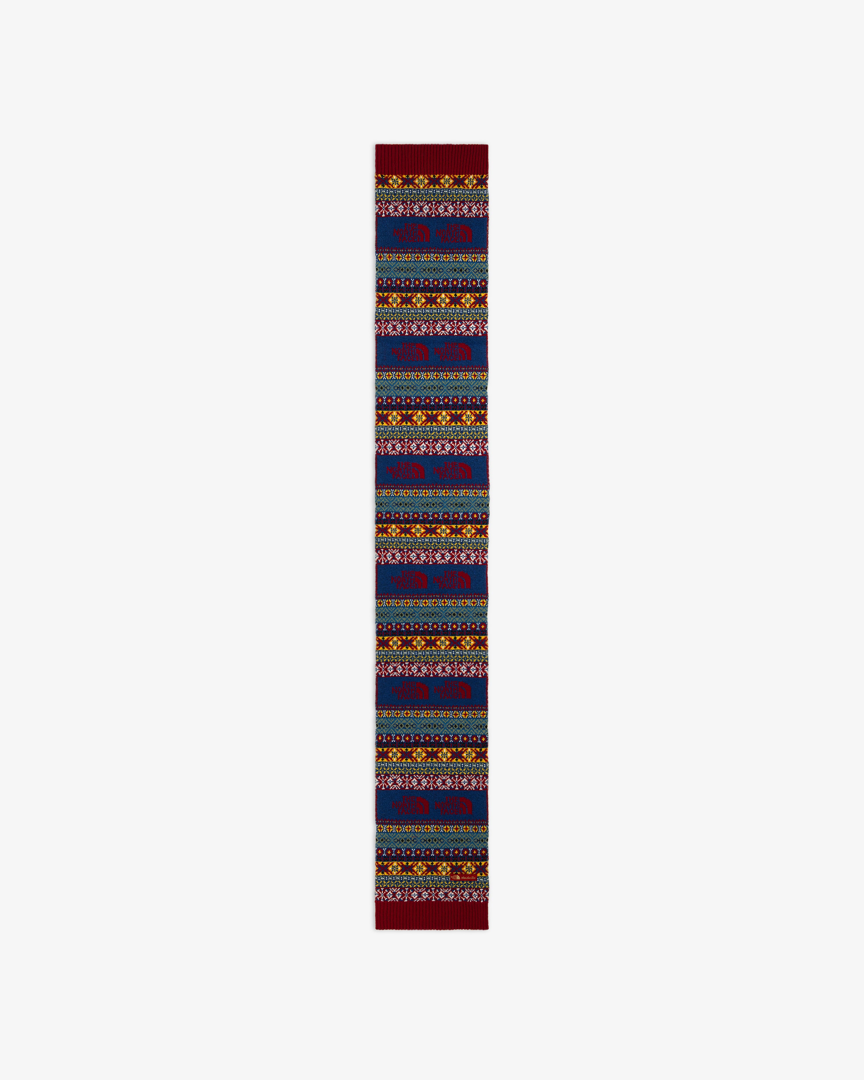 ALD / The North Face Fair Isle Scarf in blue with a multi-colored Fair Isle pattern and repeating mountain logo icons.