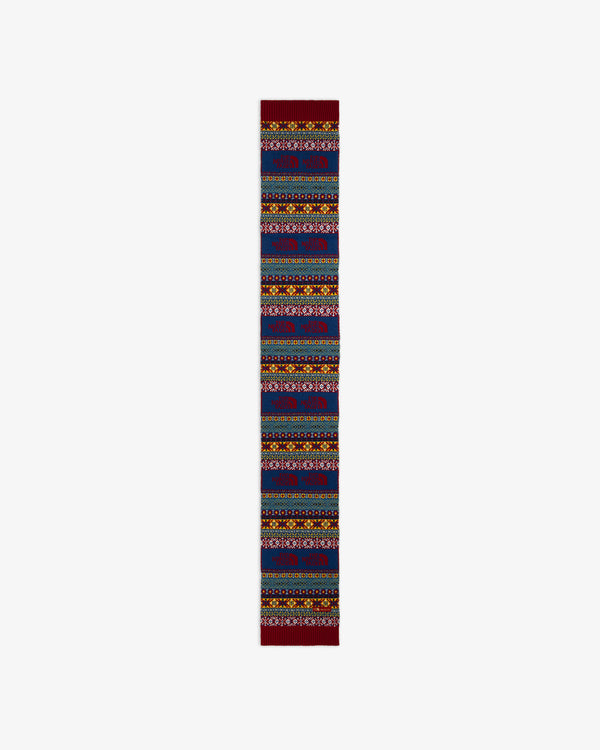 ALD / The North Face Fair Isle Scarf in blue with a multi-colored Fair Isle pattern and repeating mountain logo icons.