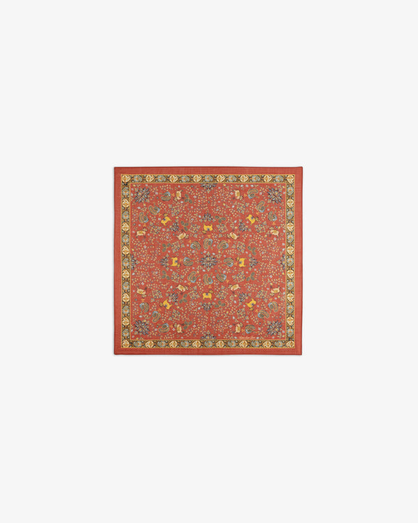 Archival Print Wool Silk Bandana in red with ornate floral and geometric motifs, trimmed in yellow and black borders.