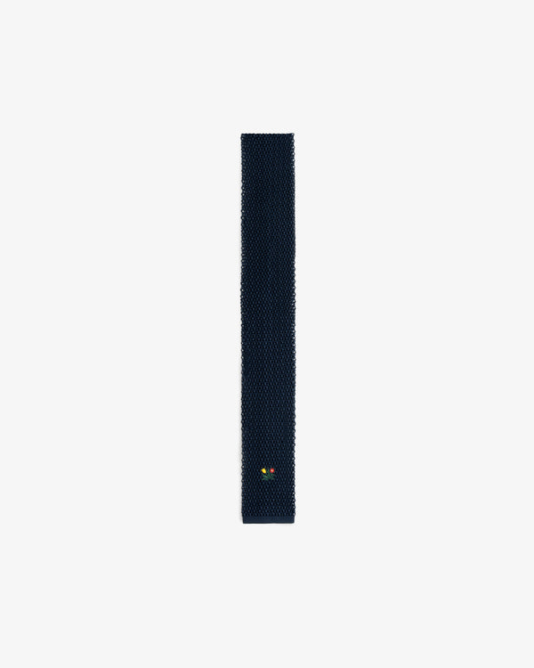 Dark navy Crest Silk Knit Tie with a small floral embroidery near the pointed tip.