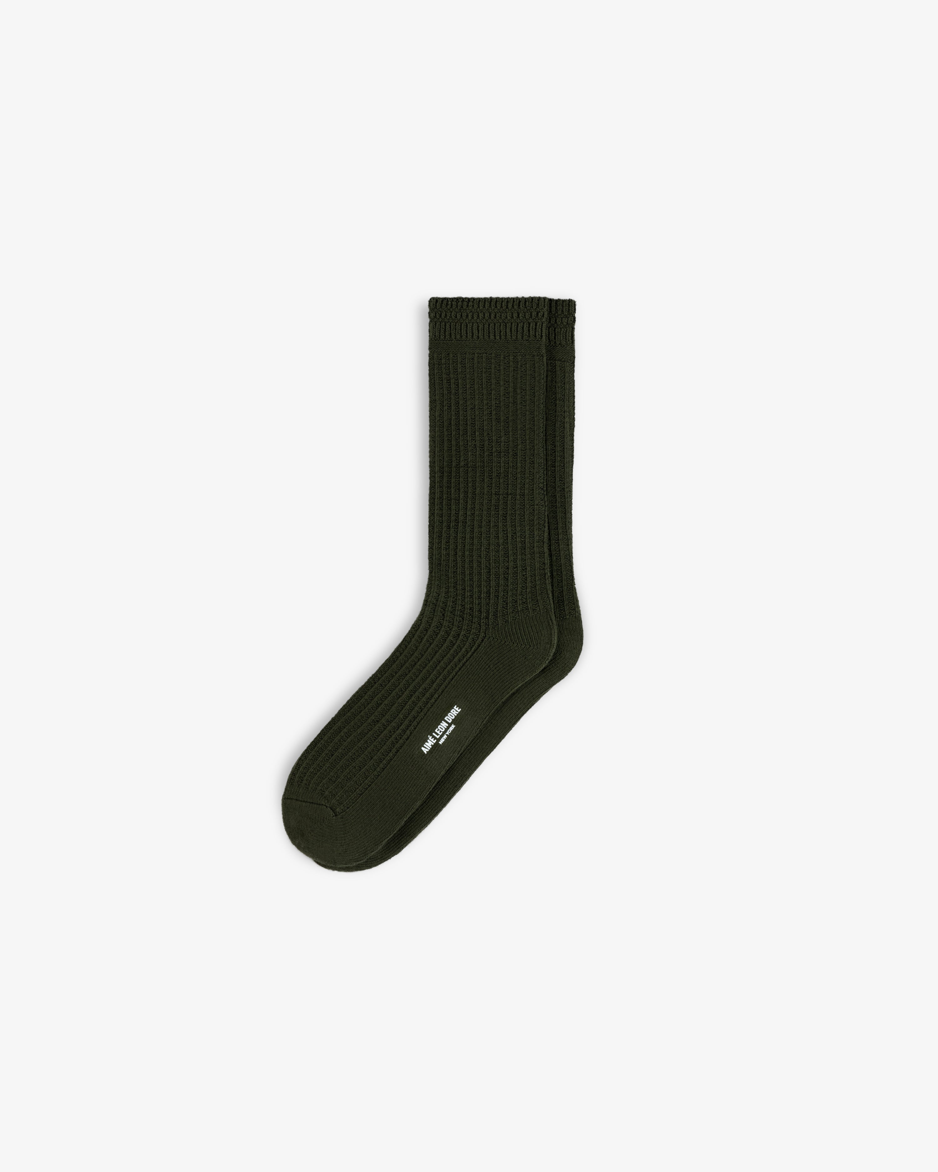 Dark green ribbed Cotton Waffle Sock with a white logo printed on the side.