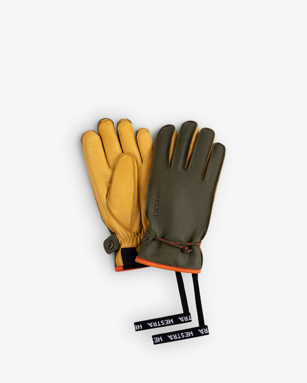 Olive green and tan leather Wakayama Gloves with orange trim and branded wrist pull tabs.