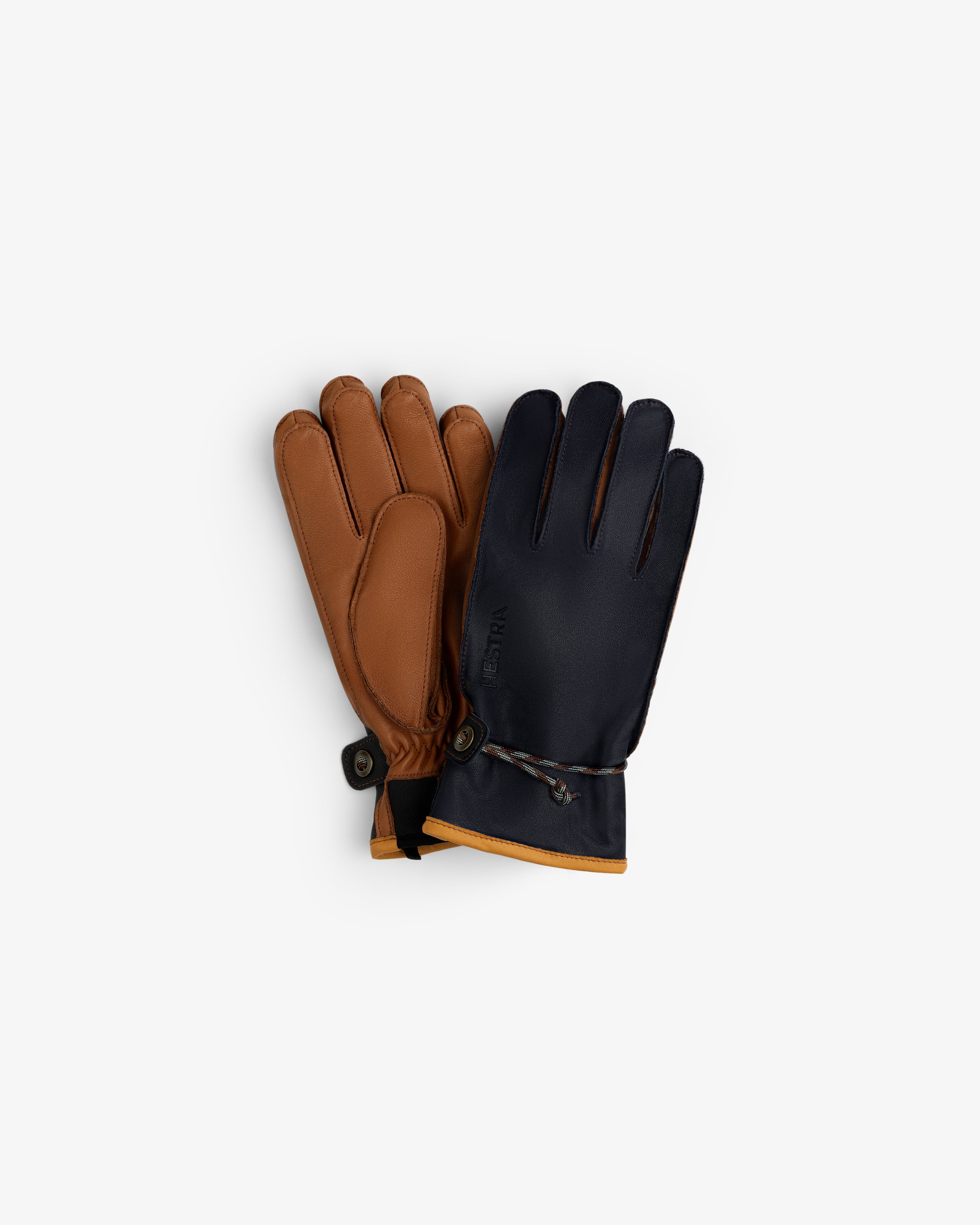 Wakayama Gloves featuring a pair of two-tone leather gloves, one brown and one navy blue with a drawstring cuff.