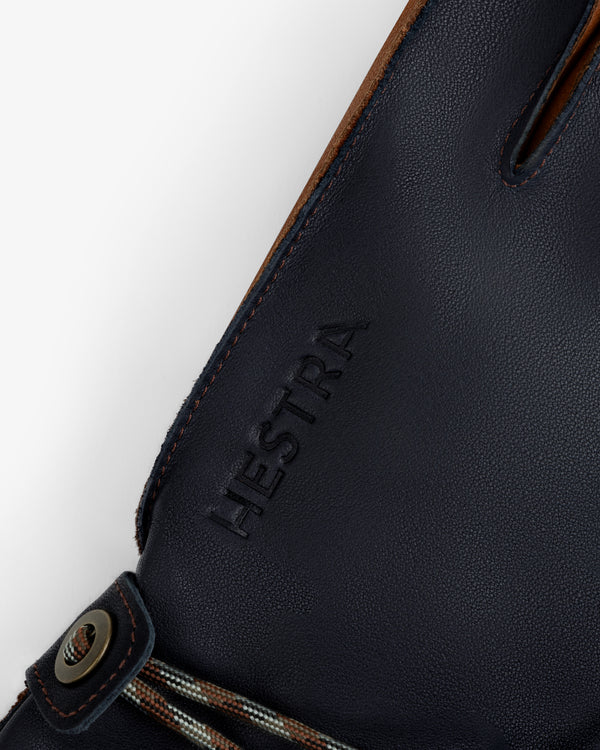Dark blue leather Wakayama Gloves with an embossed brand name and a small drawstring detail at the wrist.