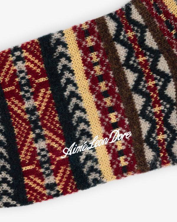 Fair Isle Quarter Sock with a red, yellow, black, and white Fair Isle pattern and white script logo embroidery.