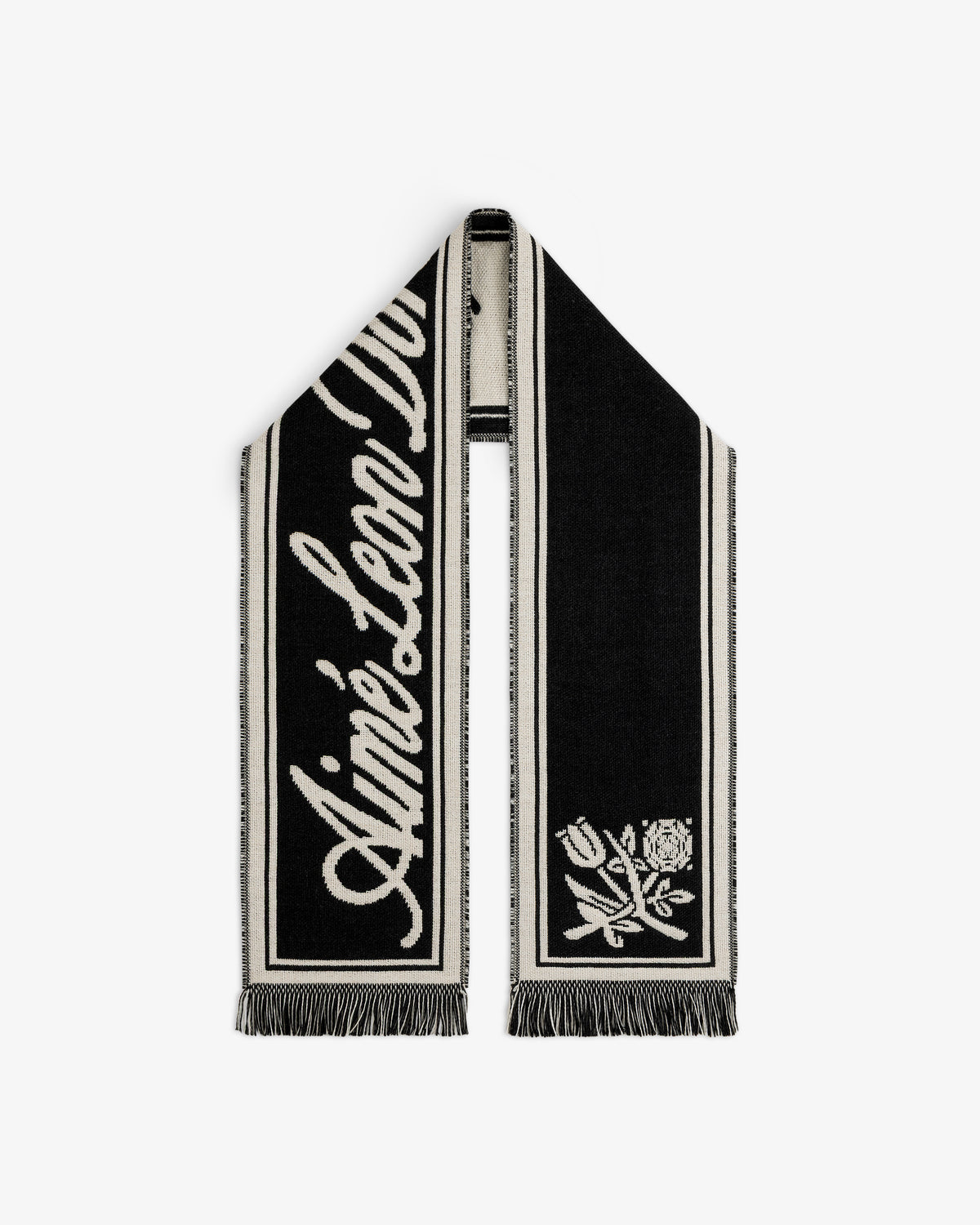 Wool Script Scarf in black and cream knit with cursive text and a floral graphic on the ends.