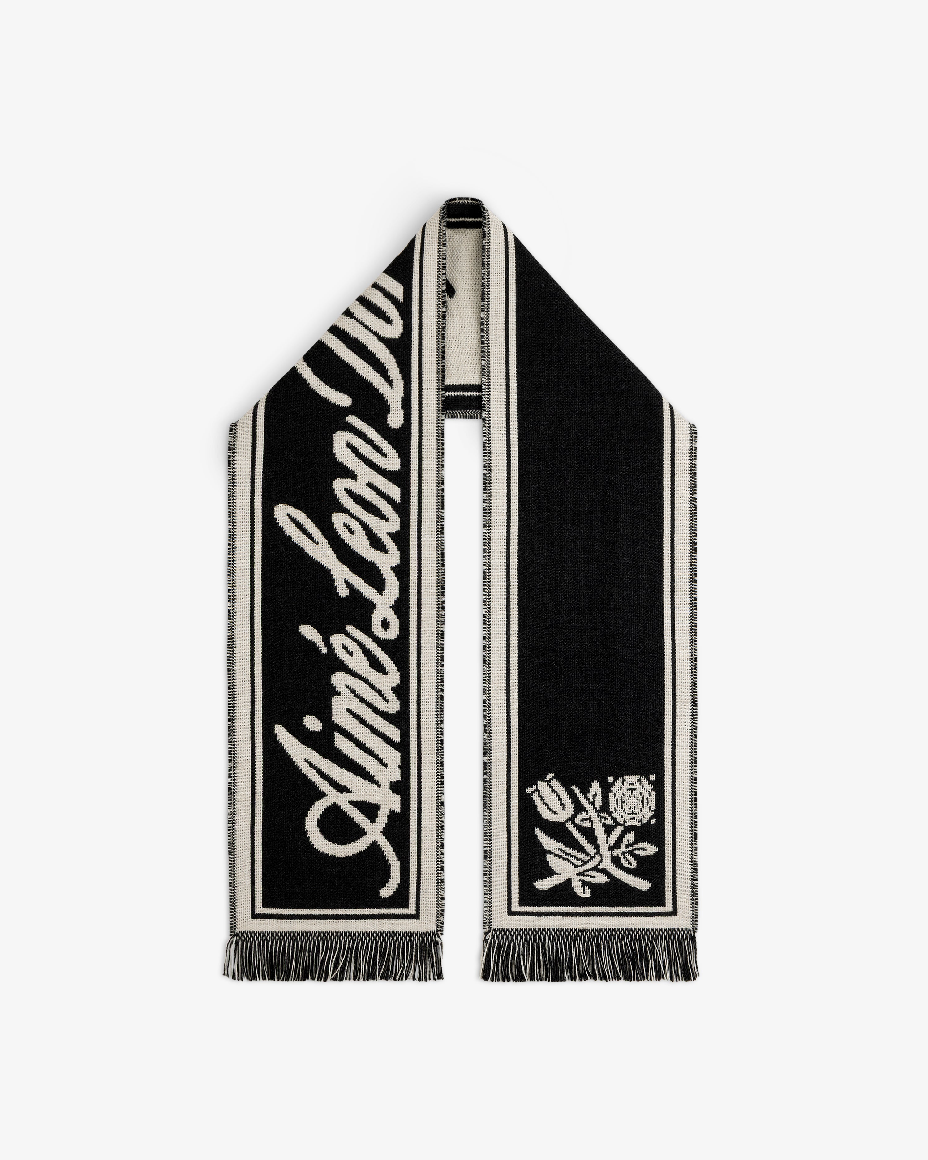 Wool Script Scarf in black and cream knit with cursive text and a floral graphic on the ends.