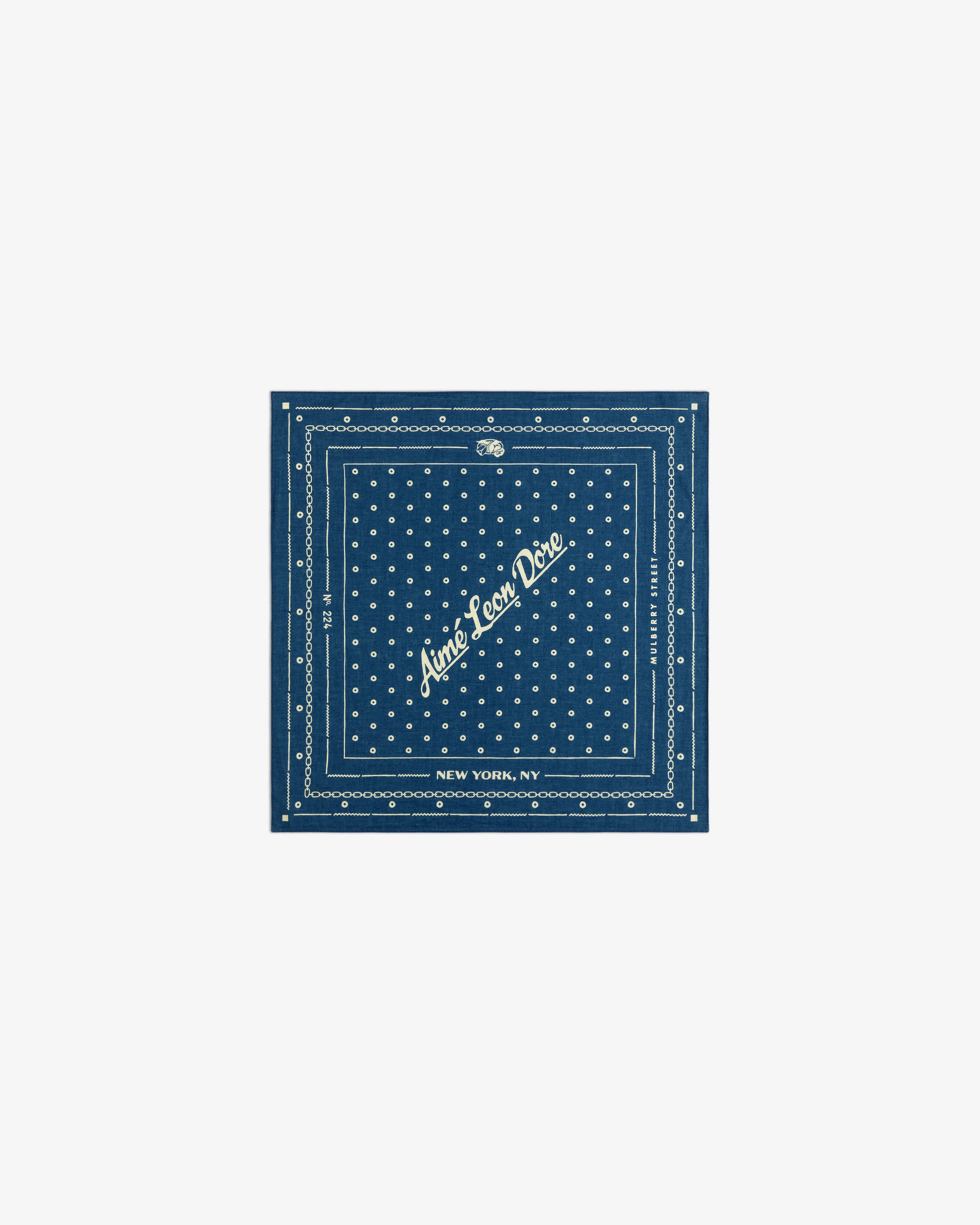 Indigo Dyed Cotton Bandana: a dark blue bandana with white polka dots and Aimé Leon Dore, New York, NY text.