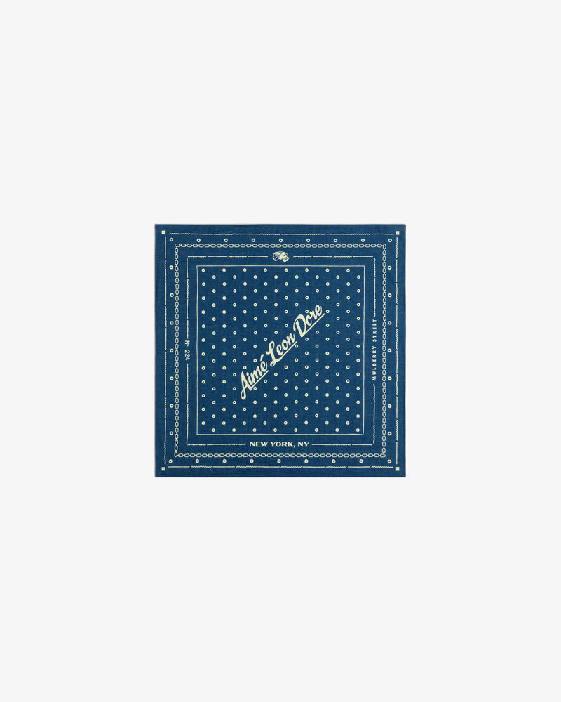 Indigo Dyed Cotton Bandana: a dark blue bandana with white polka dots and Aimé Leon Dore, New York, NY text.