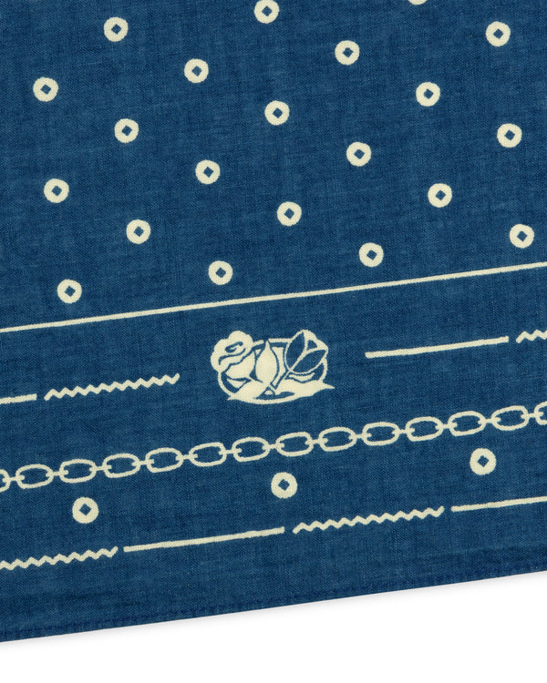 Indigo Dyed Cotton Bandana in blue with white circular patterns, a central floral motif, and decorative borders.
