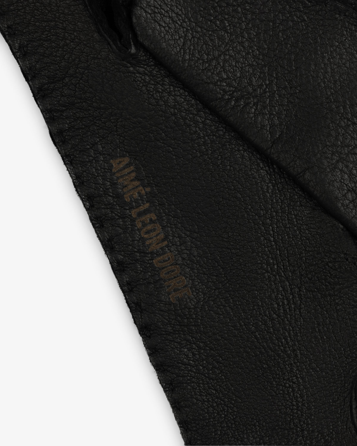 Black Henry Gloves in leather featuring the embossed text Aime Leon Dore.