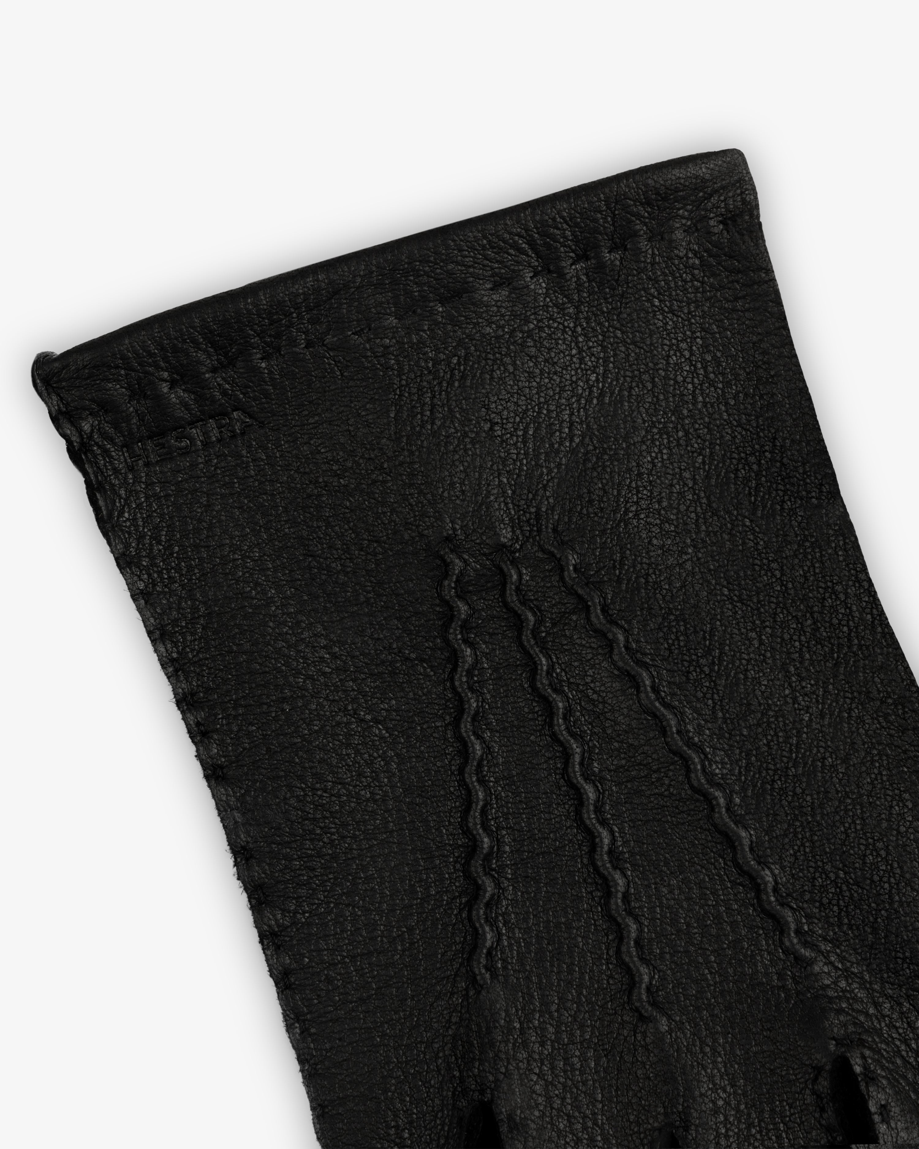 Henry Gloves in black leather with decorative stitching on the back.
