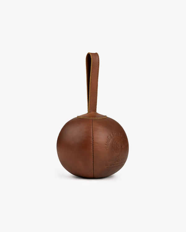 Atlas Vintage Leather 10 Lb Kettle Bell: a round brown leather kettlebell with a top handle and an embossed logo.