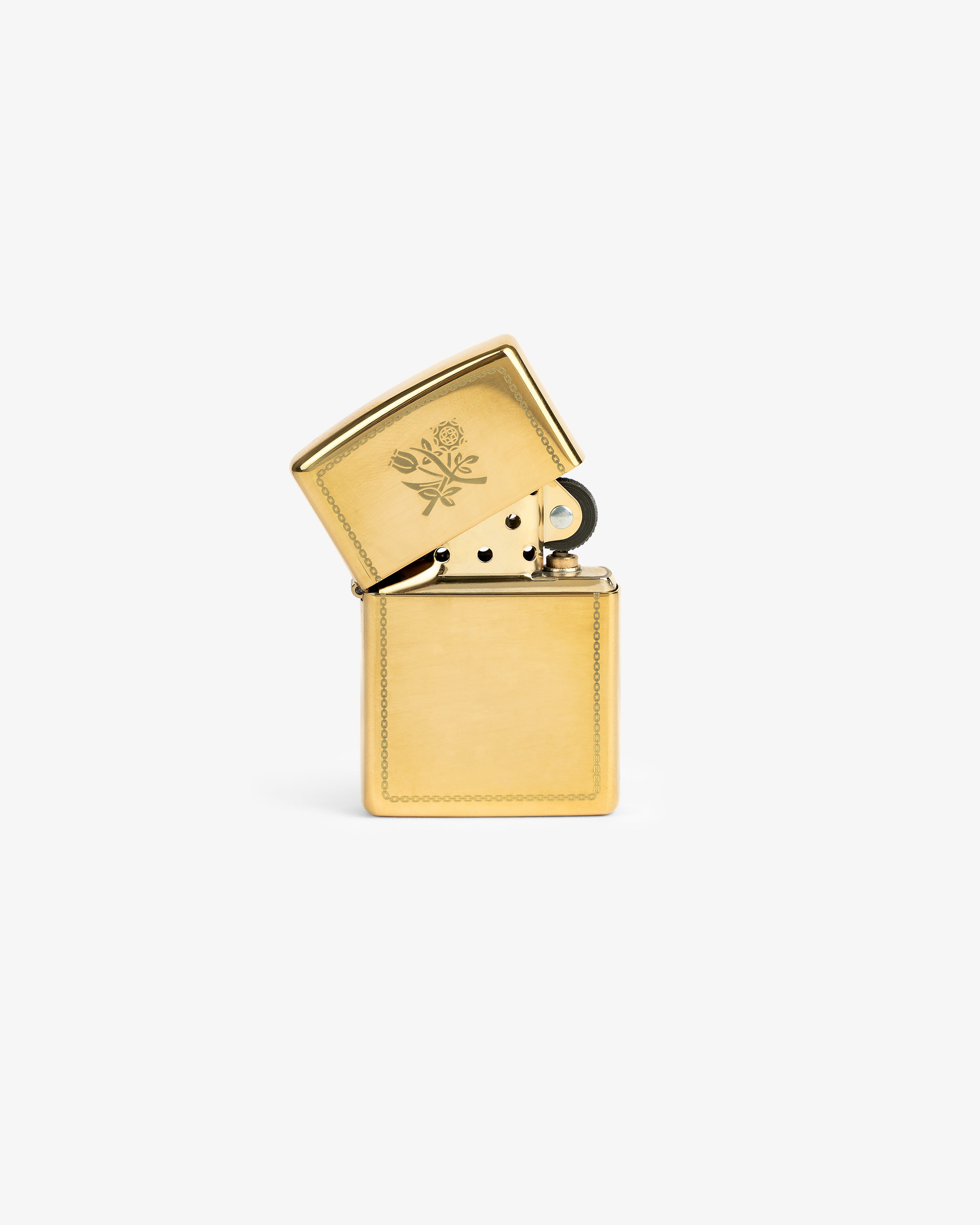 Graphic Zippo Lighter with floral engraving on the lid, open and upright on a plain white background.