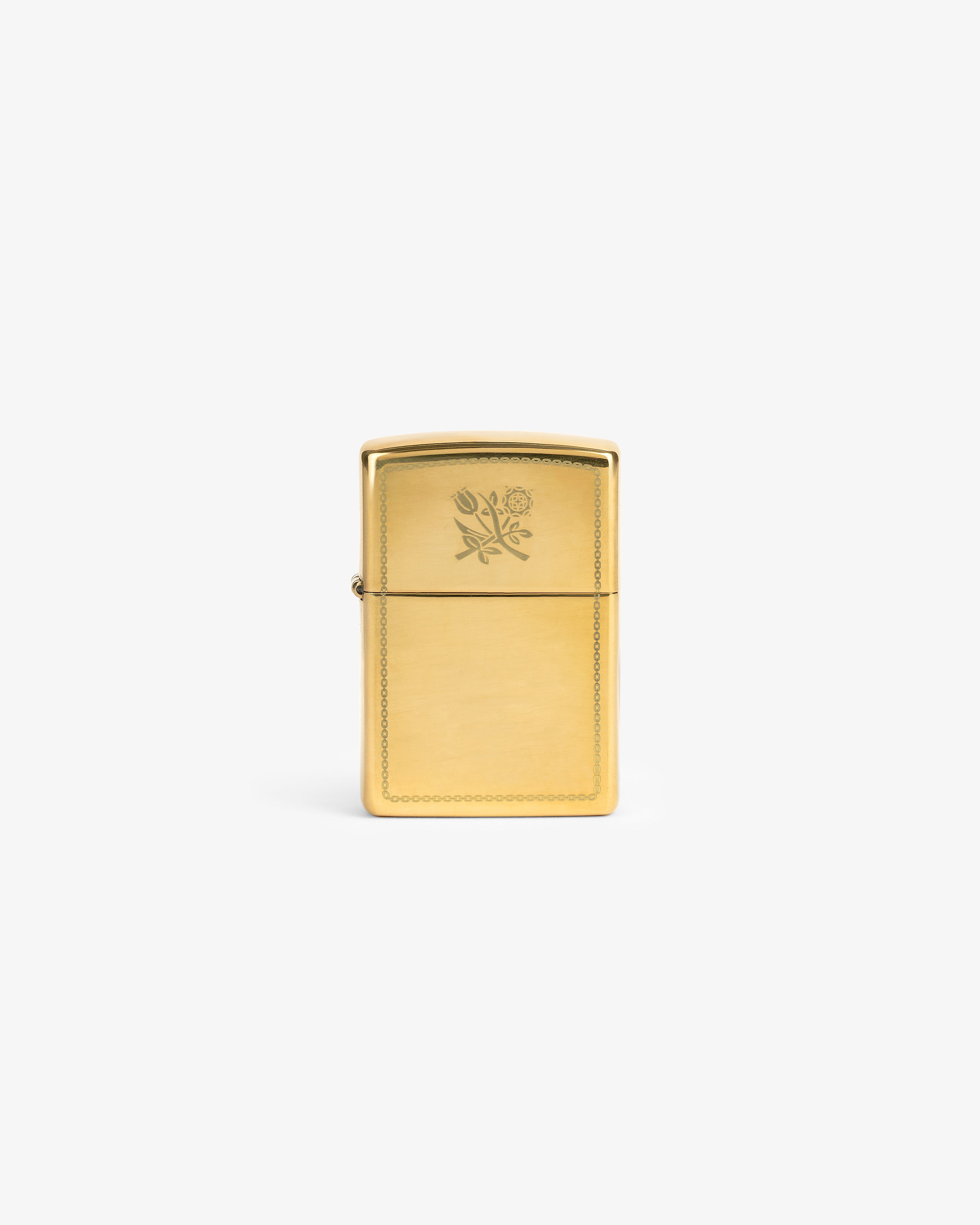 Graphic Zippo Lighter with a small floral engraving on the front, displayed against a plain white background.