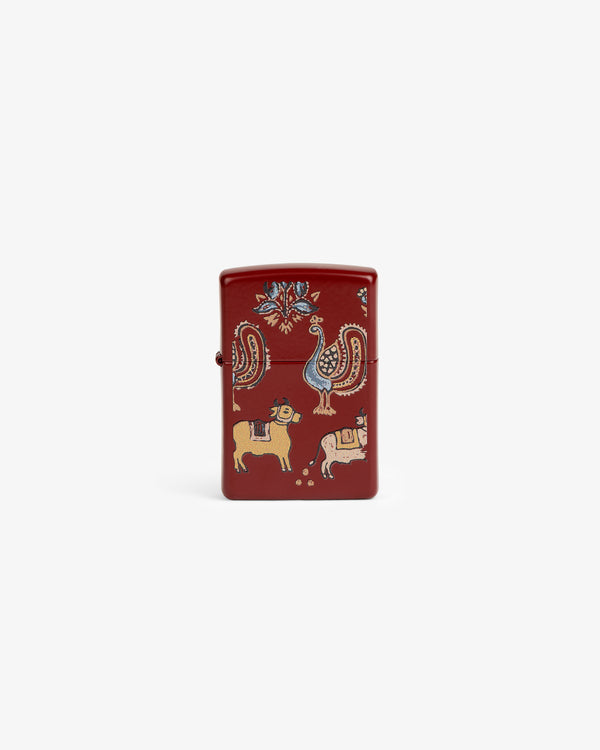 Red Graphic Zippo Lighter with colorful animal and bird designs like a peacock, lion, and bull on the front.