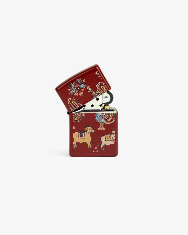 Graphic Zippo Lighter featuring vibrant animal and abstract art, displayed open on a white background.