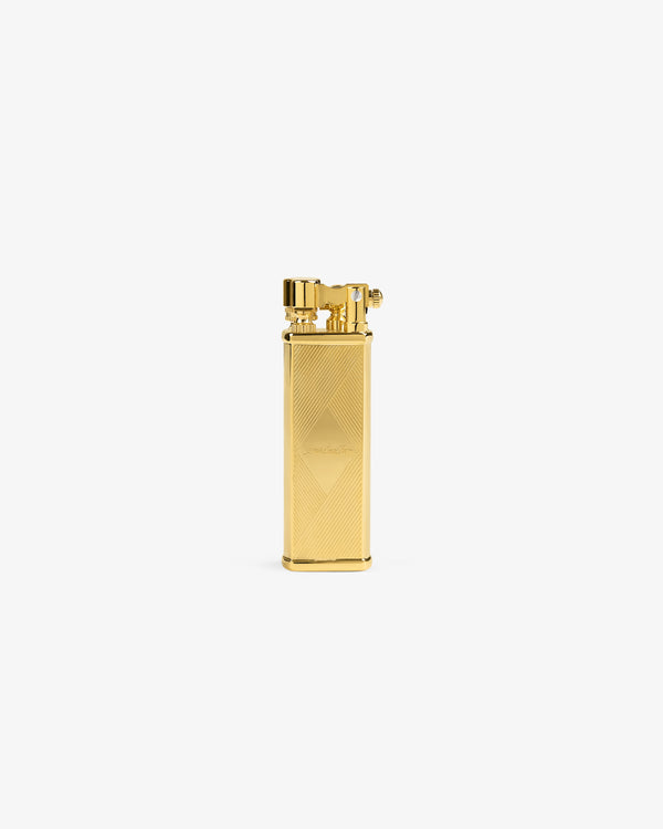The Queens Crest Engraved Lighter, gold-colored and rectangular, stands upright on a plain white background.