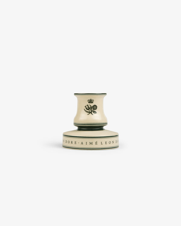 Porcelain Match Striker with a rose motif and scripted base, shown on a white background.