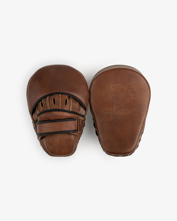 Two brown leather Atlas Vintage Leather Boxing pads, one showing the hand-entry side and the other the embossed front.