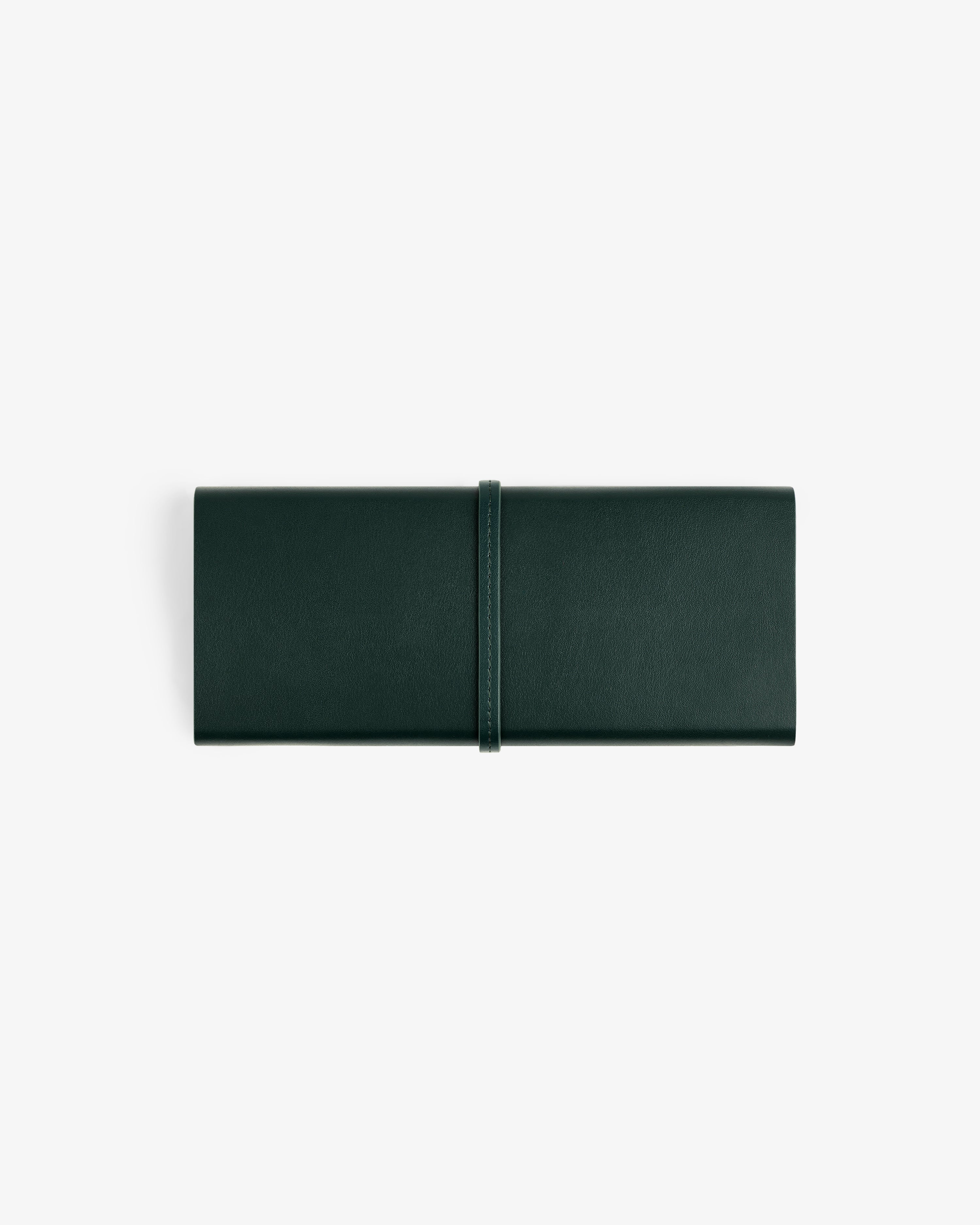 A closed Brass Measurement Kit in a dark green leather roll-up pouch with a strap, shown on a white background.