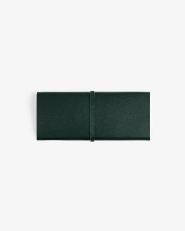 A closed Brass Measurement Kit in a dark green leather roll-up pouch with a strap, shown on a white background.