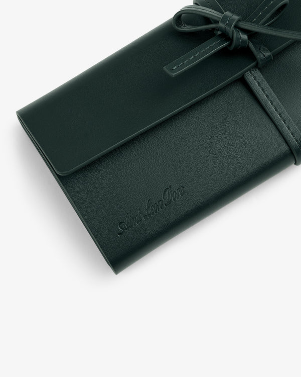 A Brass Measurement Kit featuring a tie closure and embossed ArcherOne logo on the front.