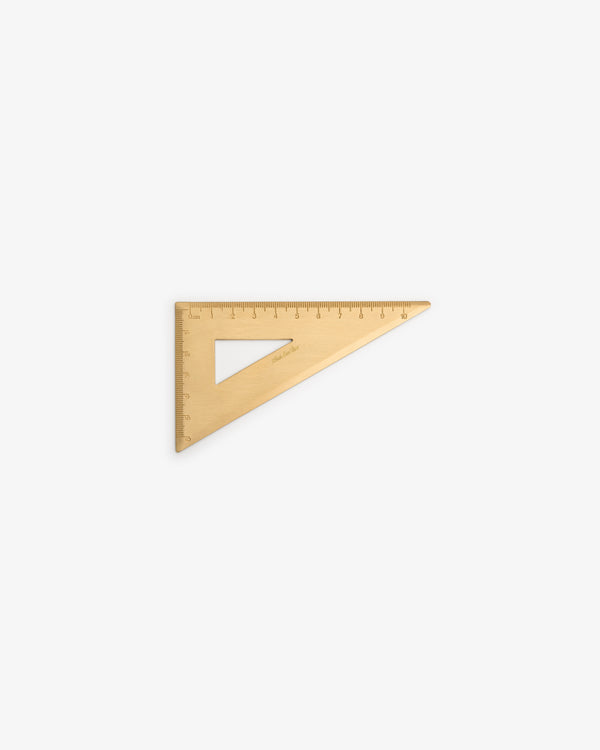 A Brass Measurement Kit with measurement markings, placed on a white background.