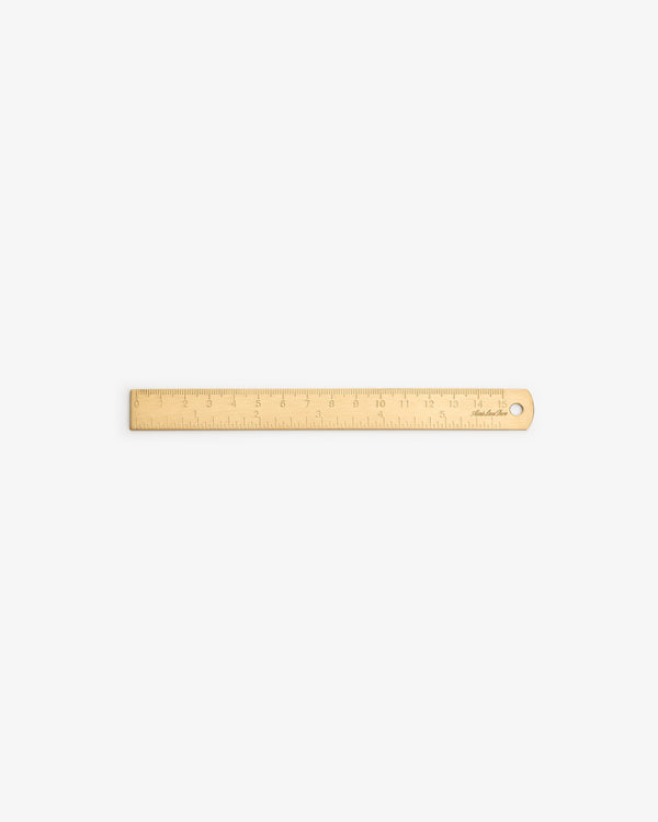 Brass Measurement Kit with inch/cm markings and a hole on one end, displayed on a white background.