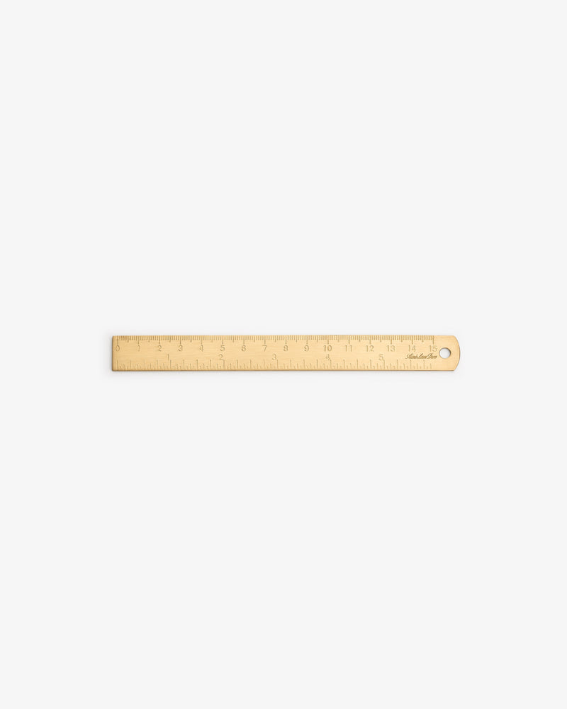 Brass Measurement Kit with inch/cm markings and a hole on one end, displayed on a white background.