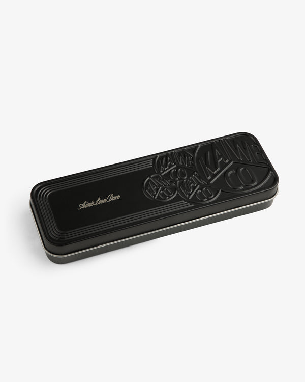 Kaweco Script Mechanical Pencil case—black, rectangular, embossed, with “Aime Leon Dore” in gold on the lid.