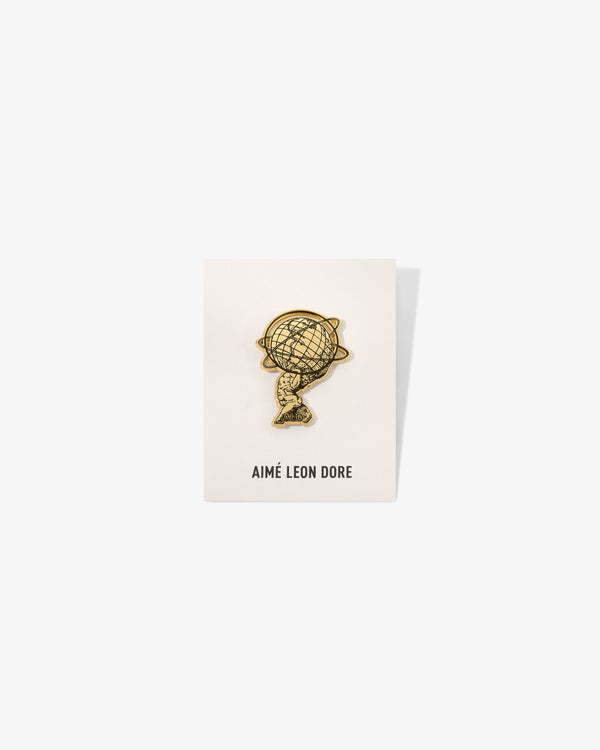 A Graphic Pin is displayed on a white card with AIMÉ LEON DORE printed at the bottom.
