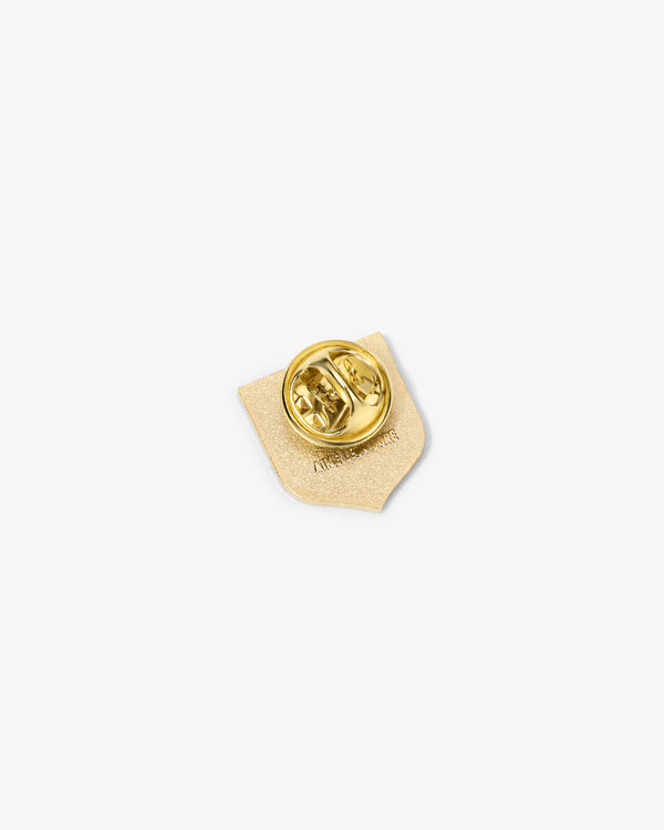 A small Graphic Pin with a butterfly clasp, shown from the back on a plain white background.