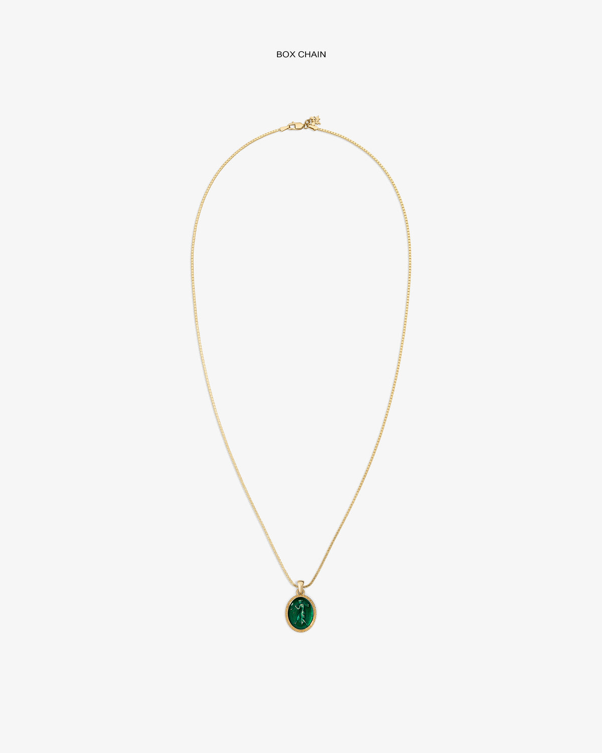 14Kt Gold Euterpe Relief Pendant featuring an oval green stone on a gold box chain.