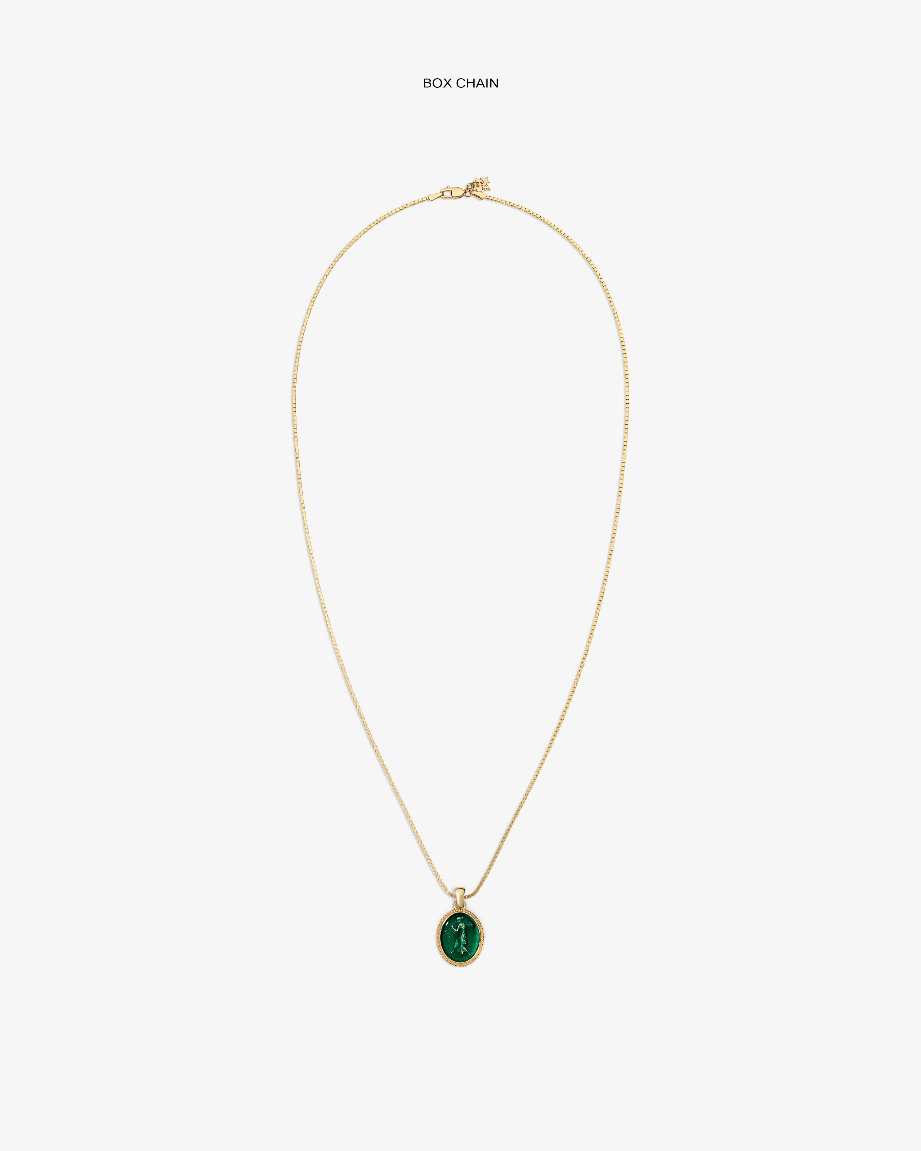 14Kt Gold Euterpe Relief Pendant featuring an oval green stone on a gold box chain.