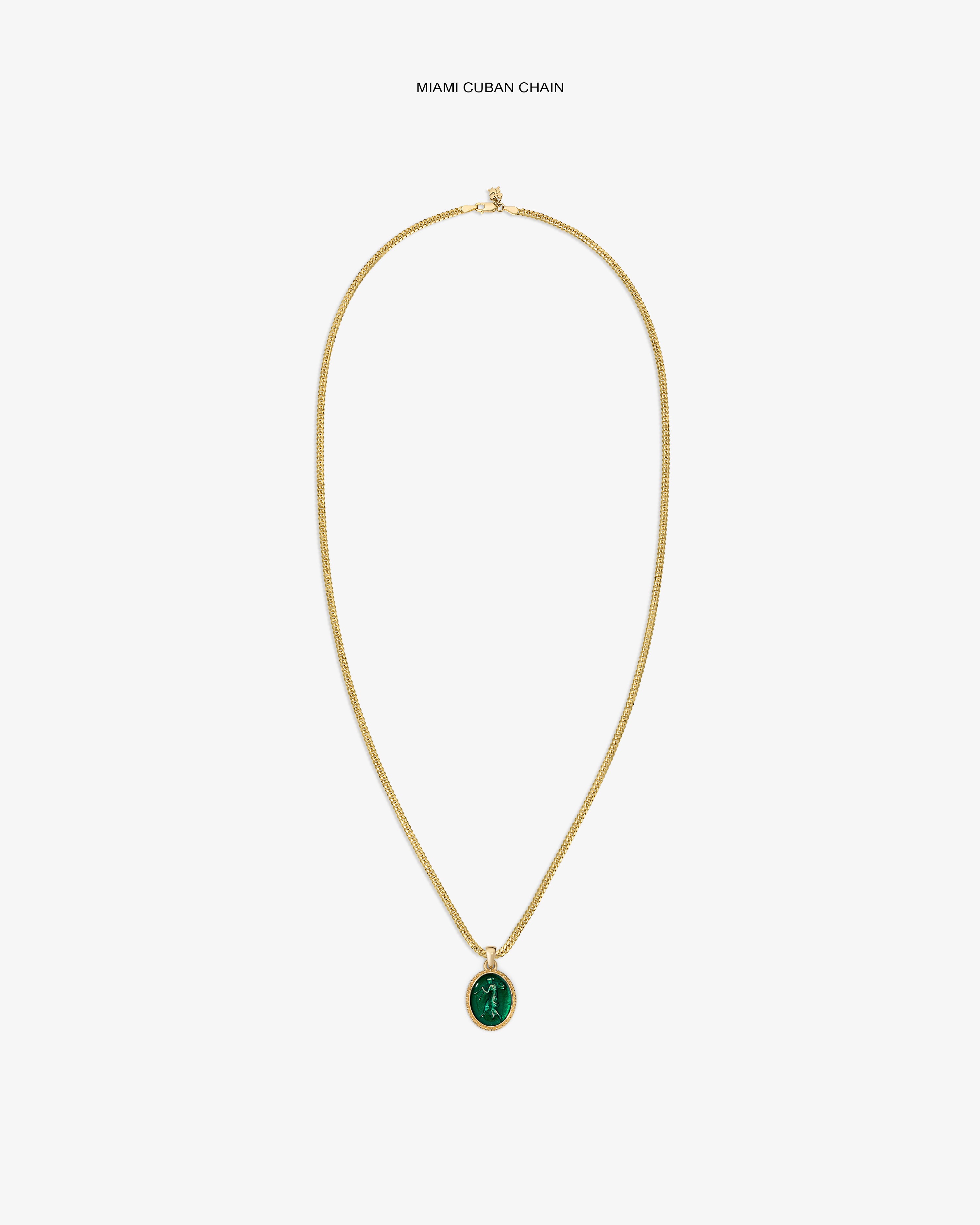 14Kt Gold Euterpe Relief Pendant: a gold chain necklace with an oval pendant featuring a green stone inlay.