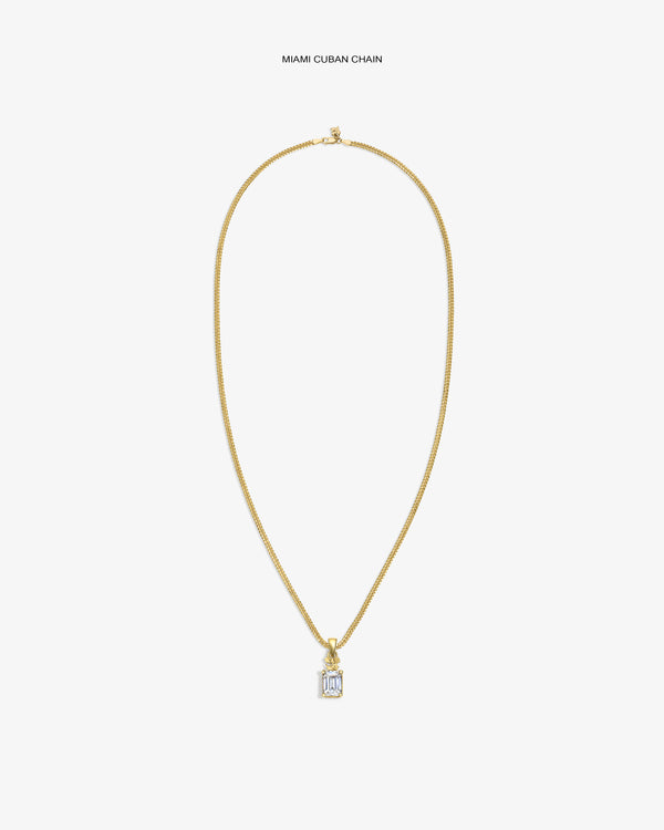 14Kt Gold Crest Gemstone Pendant on a Cuban chain, shown against a white background.