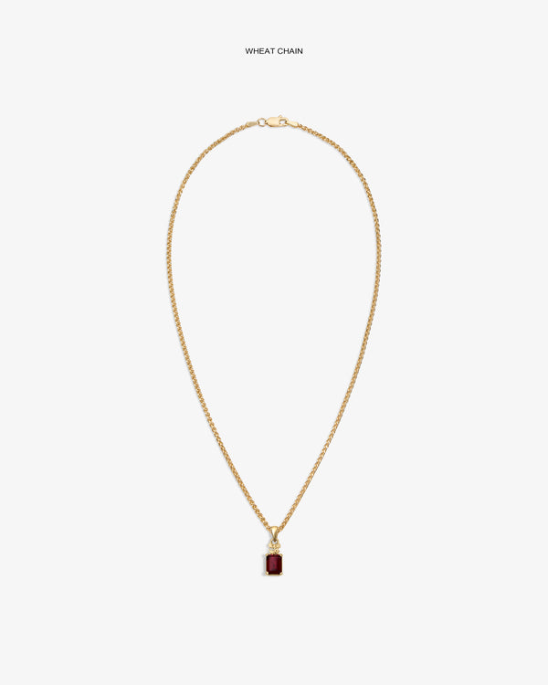 14Kt Gold Crest Gemstone Pendant with red stone on wheat chain, shown on a plain white background.
