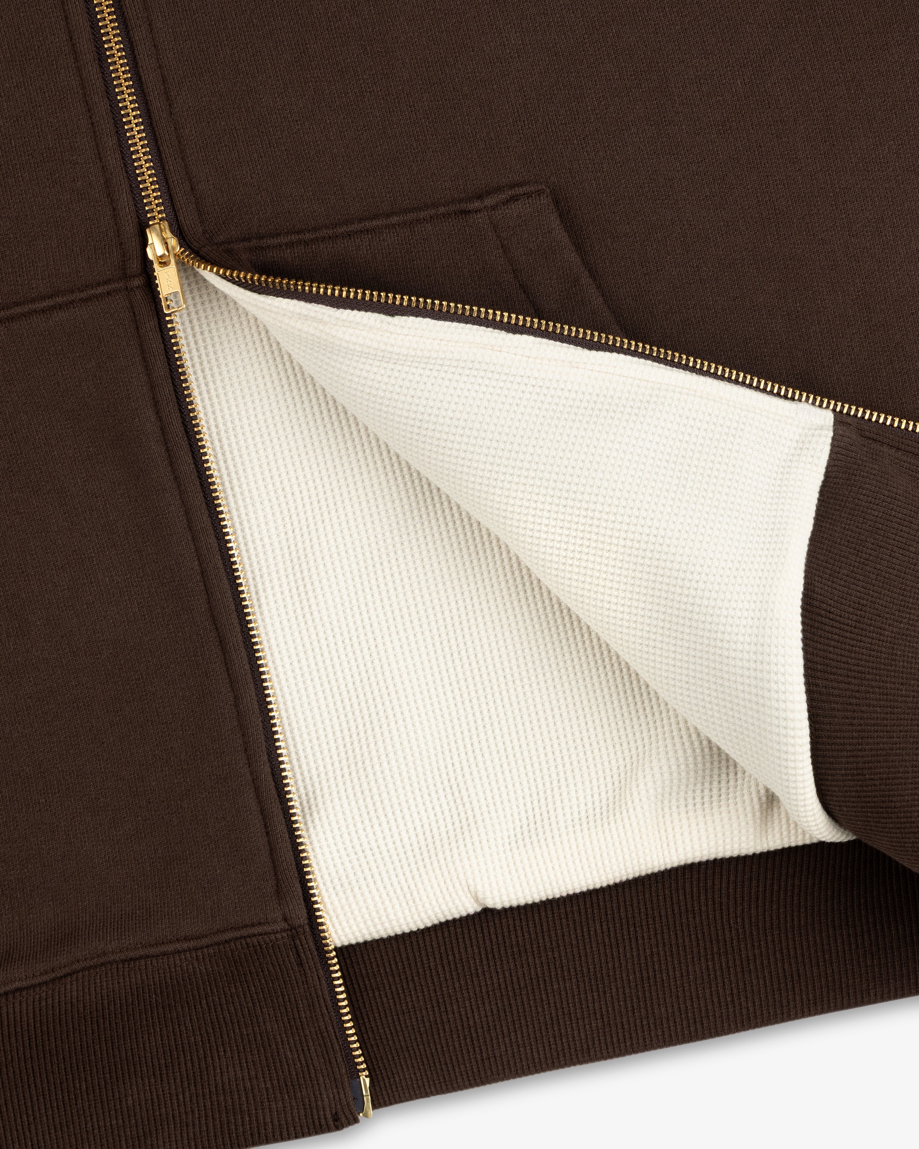 Unisphere Waffle Lined Full-Zip Hoodie in brown, gold zipper, partially open to show its textured white lining.